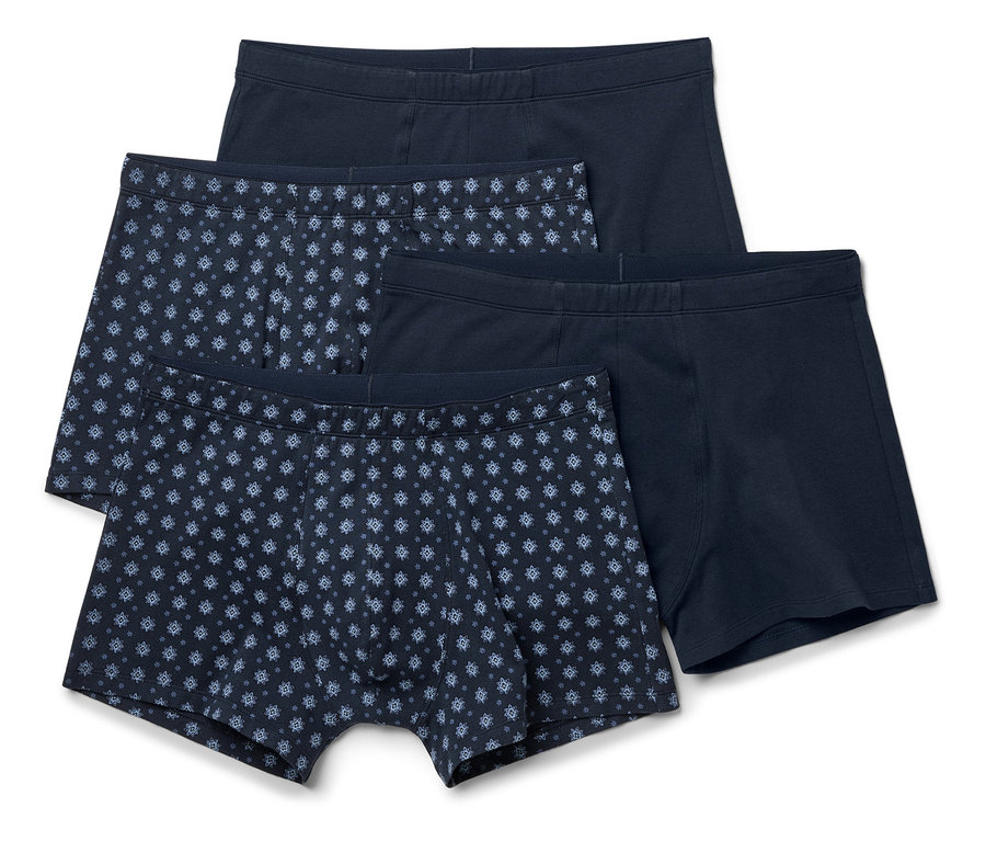 Vier marineblaue Boxershorts, zwei uni, zwei mit blauem Muster.