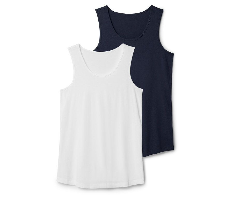 Zwei Tanktops, eines in Weiß und eines in Dunkelblau, liegen übereinander.