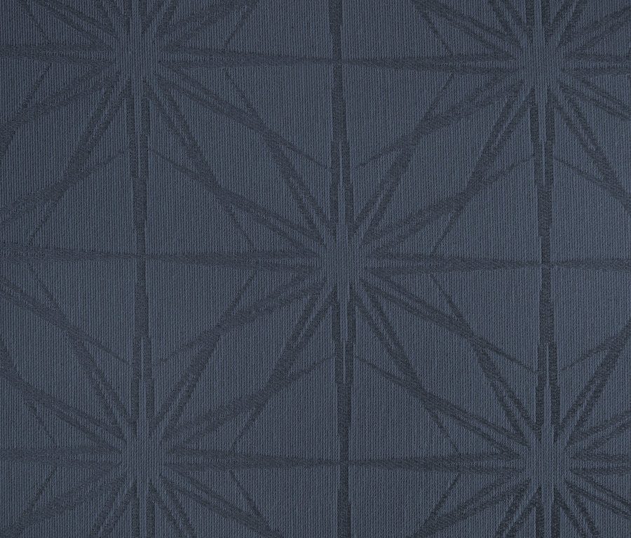 Nahaufnahme einer Jacquard-Tischdecke mit geometrischem Muster.