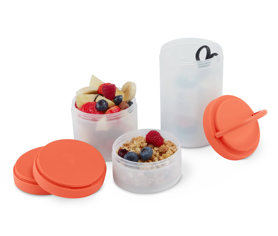 Multi-Aufbewahrungsbox mit Obst, Müsli und Zubehör.