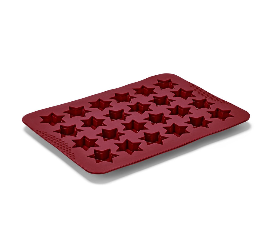 Eine rote Zimtstern Backmatte aus Silikon mit 24 sternförmigen Aussparungen.