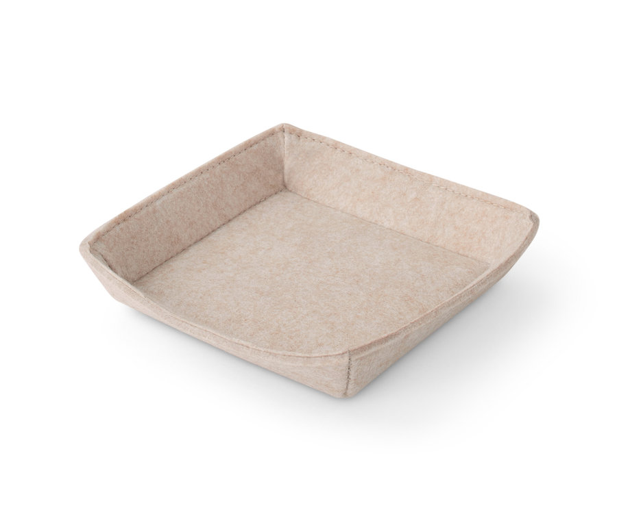 Eine Schale aus Filz in Beige.