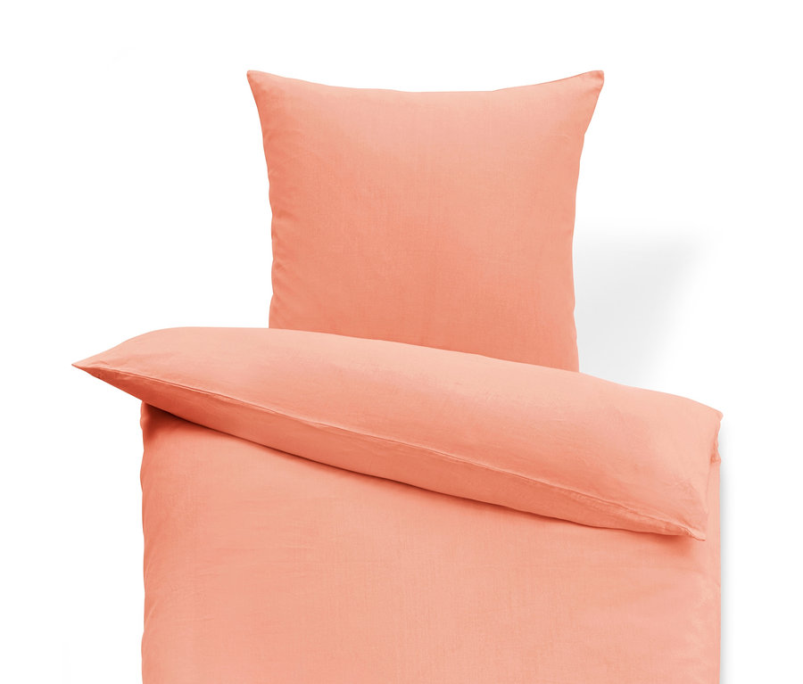 Pfirsichfarbene Leinen-Bettwäsche in Normalgröße mit Kissen oben.