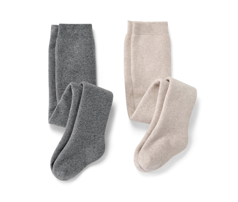 Zwei melierte Baby-Thermostrumpfhosen und zwei melierte Kinder-Thermostrumpfhosen.