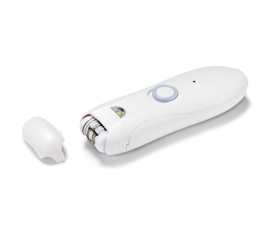 Detailaufnahme eines weißen Gesichtsepilierers mit abnehmbarem Aufsatz.