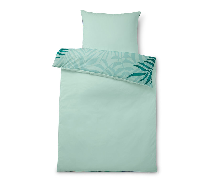 Hellgrüne Perkal-Bettwäsche mit Blätterdruck und Kopfkissen.