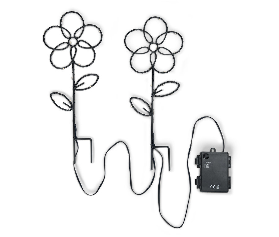 Zwei schwarze Blumen-Gartenleuchten mit LED-Lichtern und einem Batteriekasten auf einem weißen Hintergrund.
