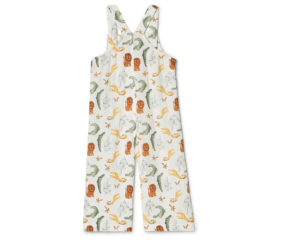 Ein weißer Overall mit einem Muster aus Löwen, Krokodilen und Sternen.