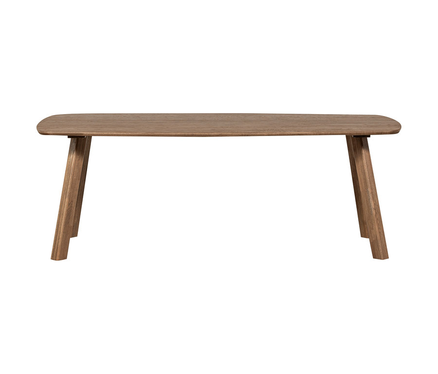 Ein rechteckiger Holztisch mit abgerundeten Ecken und schrägen Beinen.