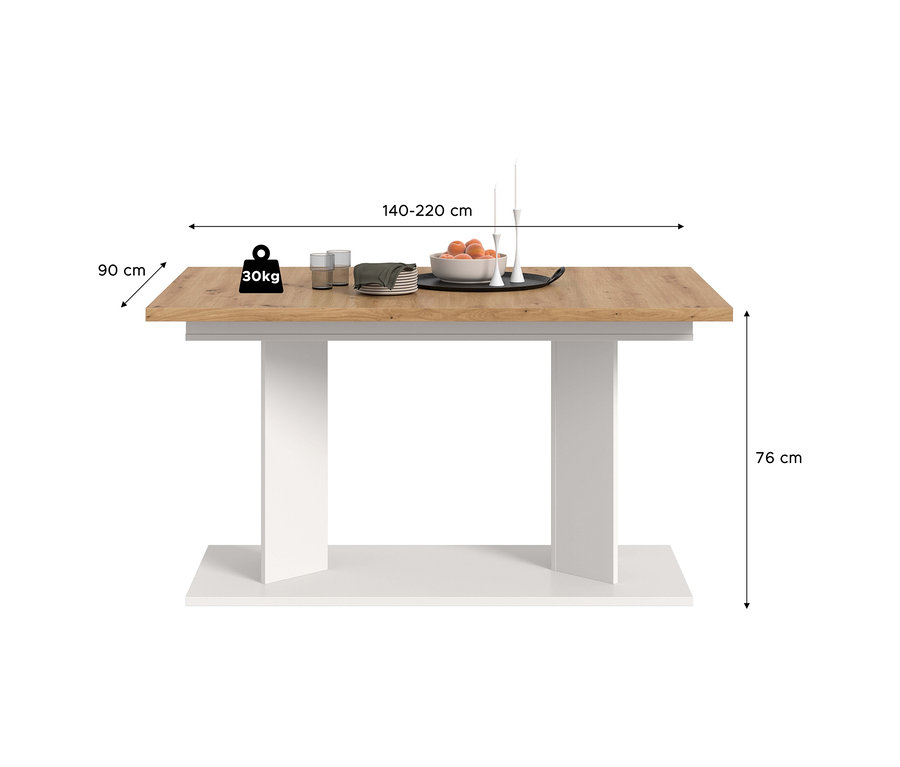 Weißer xonox Esstisch Victor XL mit hellbrauner Platte und weißem Gestell. Der Tisch ist 140-220 cm lang, 90 cm breit und 76 cm hoch. Auf der Platte stehen eine Obstschale, Teller, Gläser und ein Kerzenständer. Ein Symbol zeigt 30 kg an.