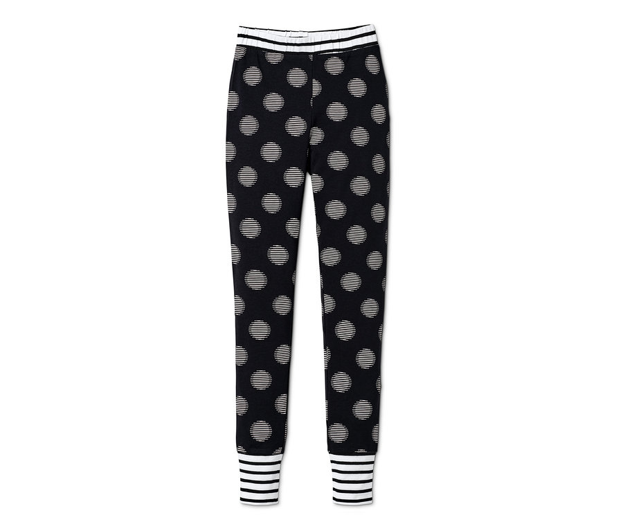 Mädchen-Pyjama-Hose mit schwarzem Hintergrund und weißen Punkten.