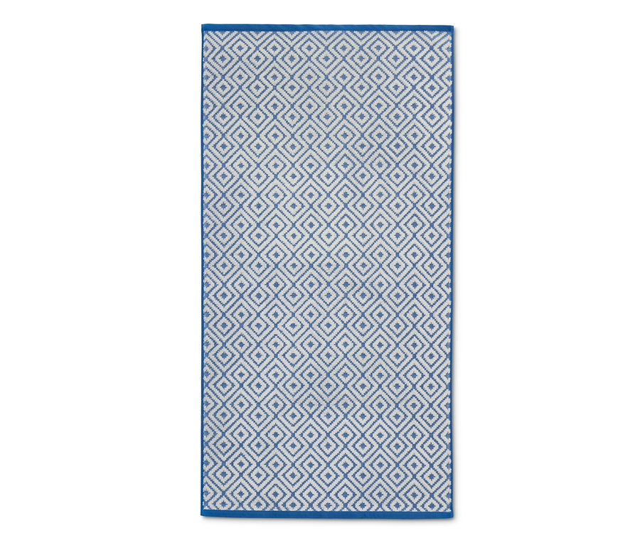 Blau-weißes Jacquard-Badetuch mit geometrischem Muster.