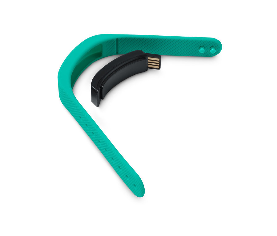 Grüner Schrittzähler mit Uhr und schwarzem USB-Anschluss auf weißem Hintergrund.