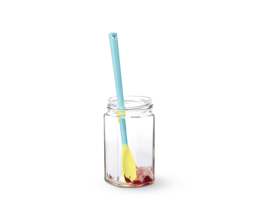 Blau-gelber Spezial-Silikonlöffel in einem Glas mit Marmelade.