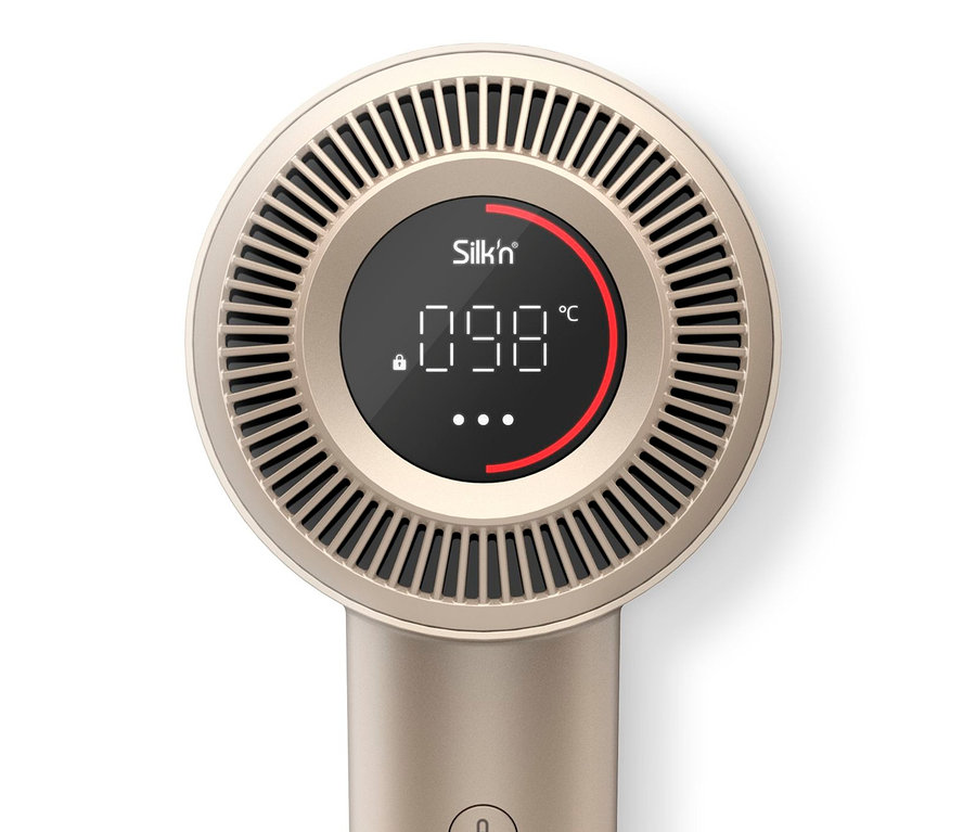 Detailansicht des goldenen Silk'n SilkyAir Pro Haartrockners mit Temperaturanzeige.