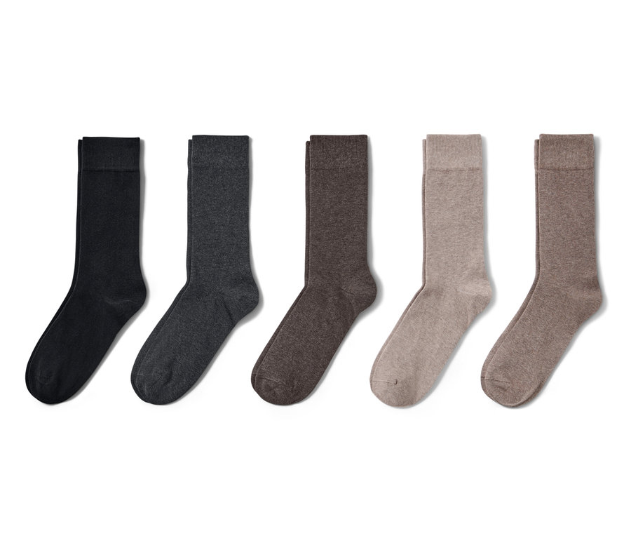 Fünf Paar Socken in Schwarz, Dunkelgrau, Braun und Beige.
