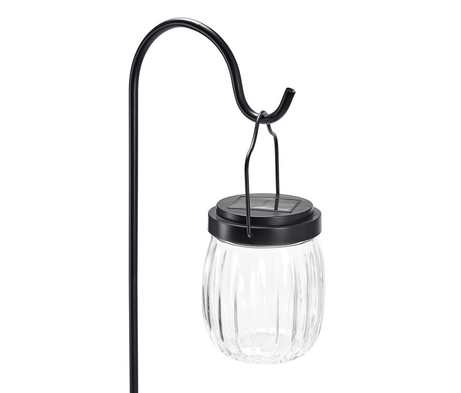 Nahaufnahme einer Spieß-Solar-Leuchte mit transparentem Glasschirm und schwarzem Metallrahmen.