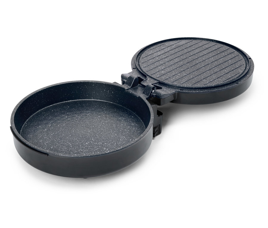 Offene, runde, schwarze Grillpfanne mit geriffelter Oberseite und gesprenkelter Innenseite.