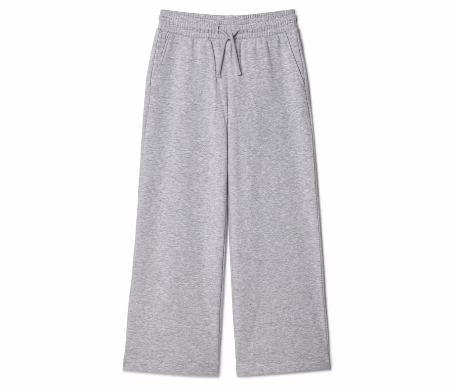 Graue, weite Stoffhose mit Kordelzug und Taschen, liegend auf weißem Hintergrund.
