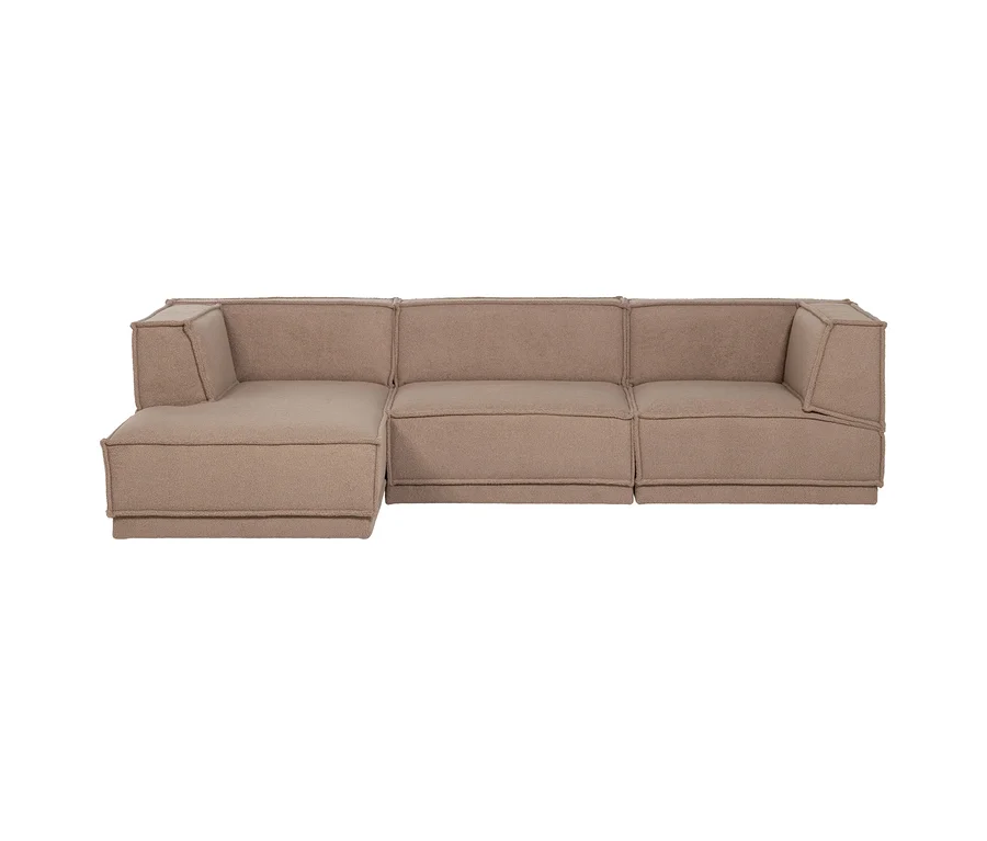Hellbraunes L-förmiges Modulsofa mit drei Elementen und sichtbaren Nähten.