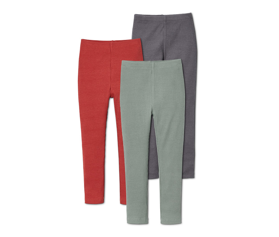 Drei Leggings aus Bio-Baumwolle in Rot, Grün und Grau.