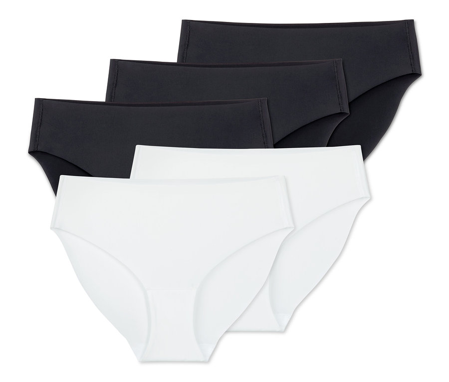 Vier Magic-Cut-Slips, 2 schwarze und 2 weiße, liegen übereinander.