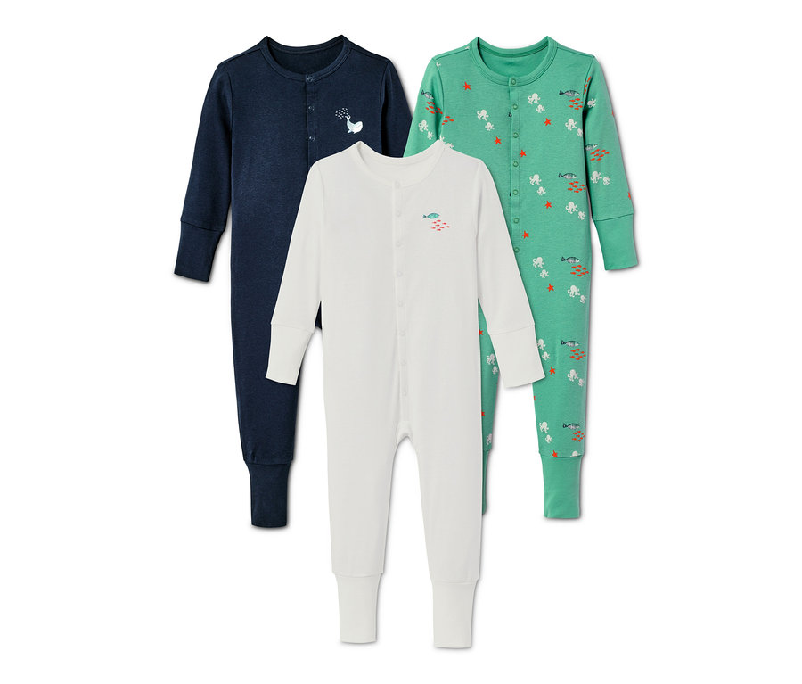 Drei Baby Baumwoll-Pyjamas.