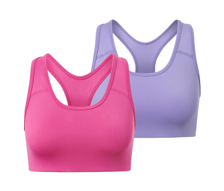 Zwei Sport-Bustiers: ein pinkfarbener und ein lilafarbener.