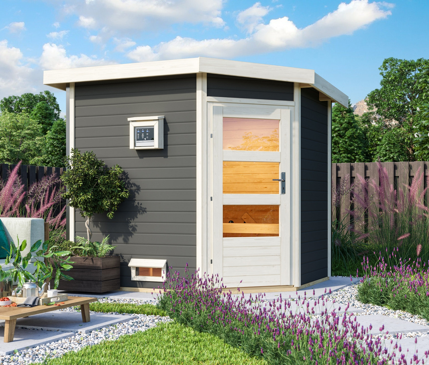 Im Garten steht ein terragraues Karibu Saunahaus »Mari«.