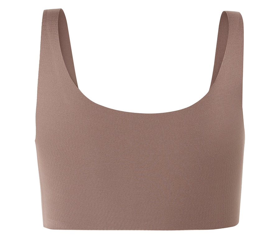 Nahaufnahme eines beigefarbenen Sport-BHs mit breiten Trägern und U-Ausschnitt.