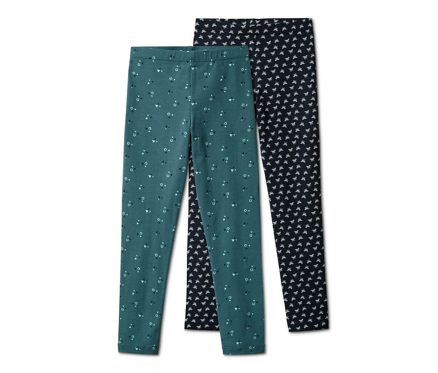Zwei Leggings: eine grüne mit geometrischen Formen und eine dunkelblaue mit Pferde-Print.