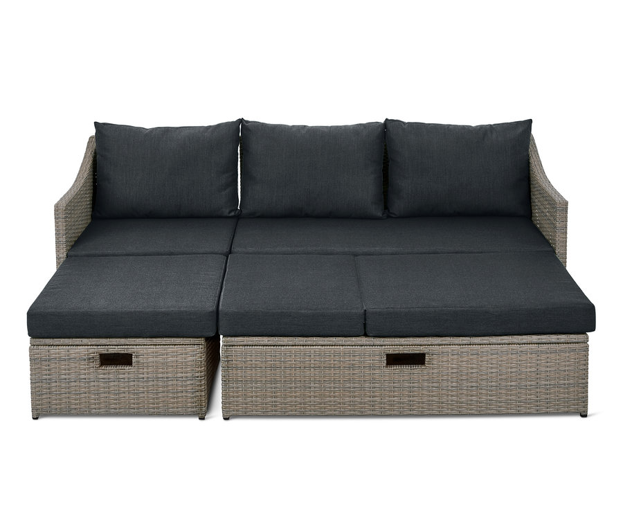 Graues Lounge-Schlafsofa »Thore« mit Ausziehfunktion und grauen Kissen.