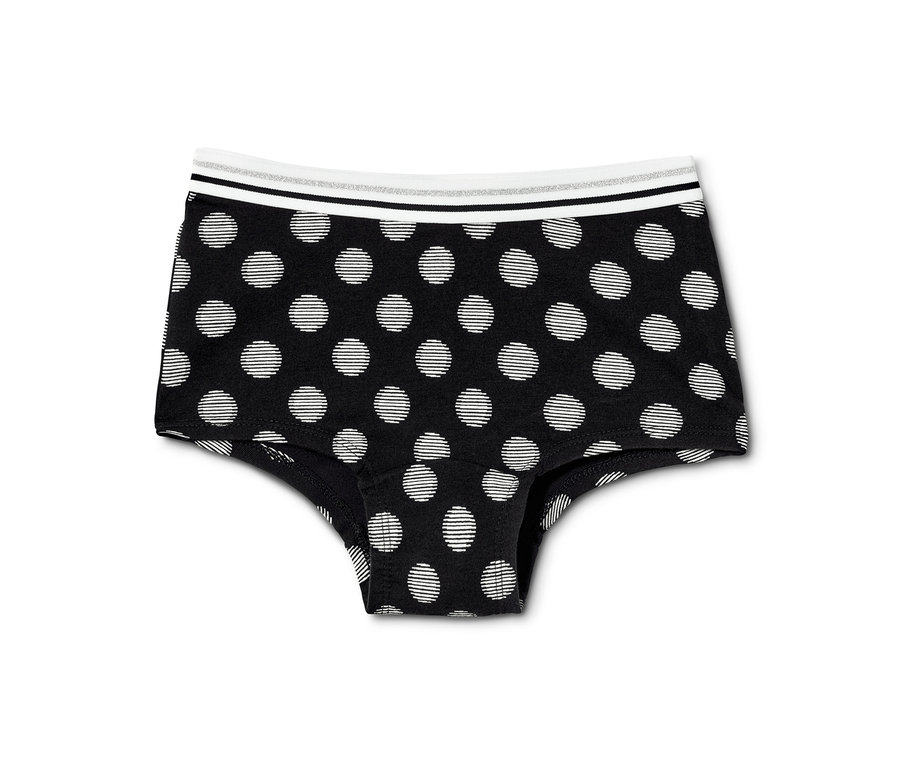Schwarze Mädchen-Pantys mit weißen Punkten. 7 Mädchen-Pantys, schwarz-weiß.