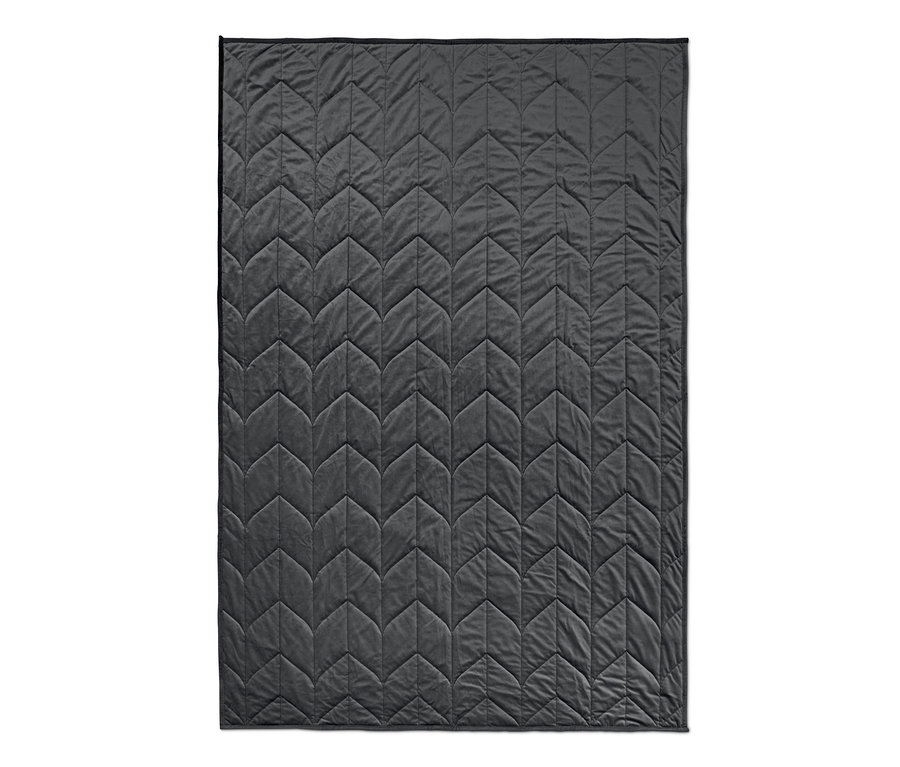 Eine graue Entspannungs-Gewichtsdecke mit geometrischem Steppmuster.