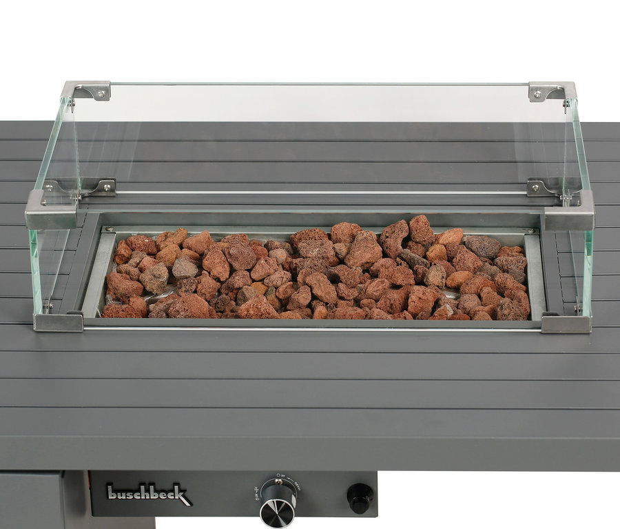 Detailansicht des grauen Buschbeck Loungetisch »Lagos« mit Lavasteinen in der Mitte und Glasabdeckung.