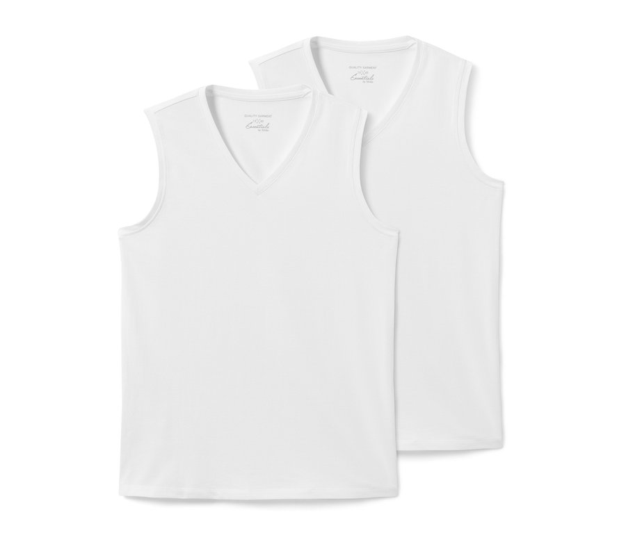 Zwei weiße Sommer-Tanktops liegen übereinander.