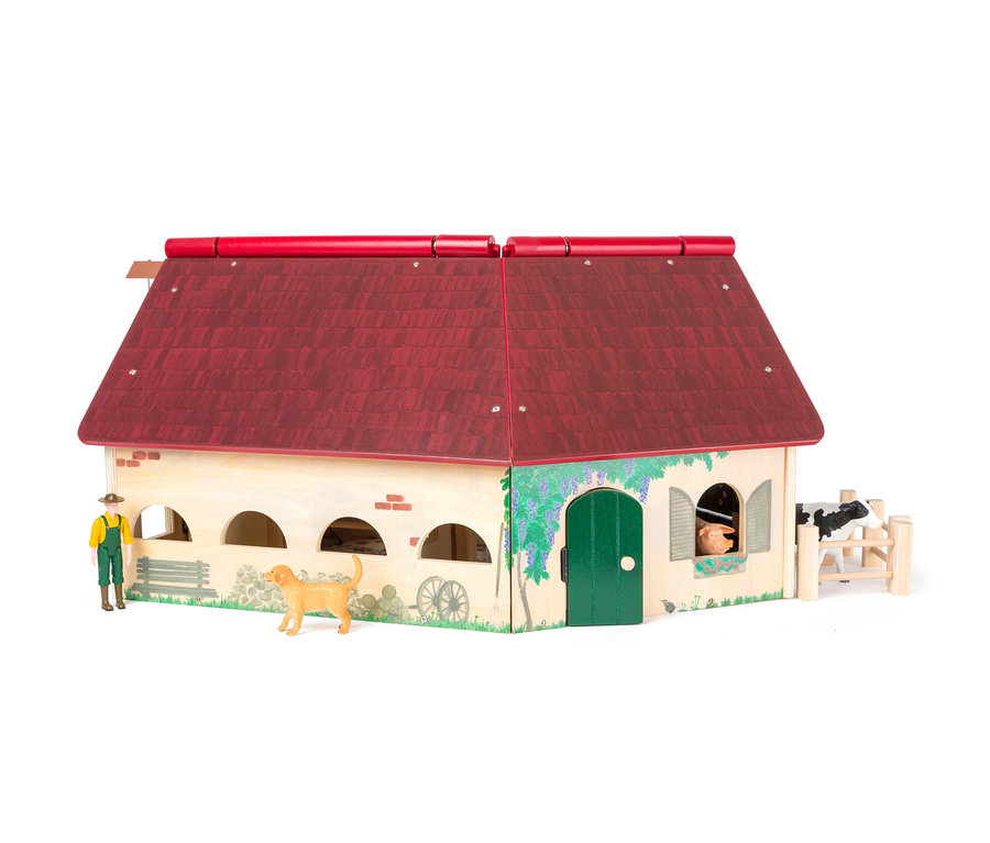 Ein Holzspielzeug-Bauernhof mit rotem Dach, Tierfiguren und einem Bauern.