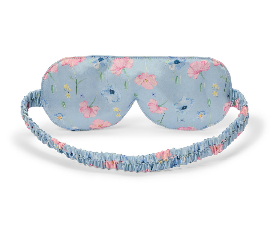 Hellblaue Schlafmaske mit Blumenmuster.