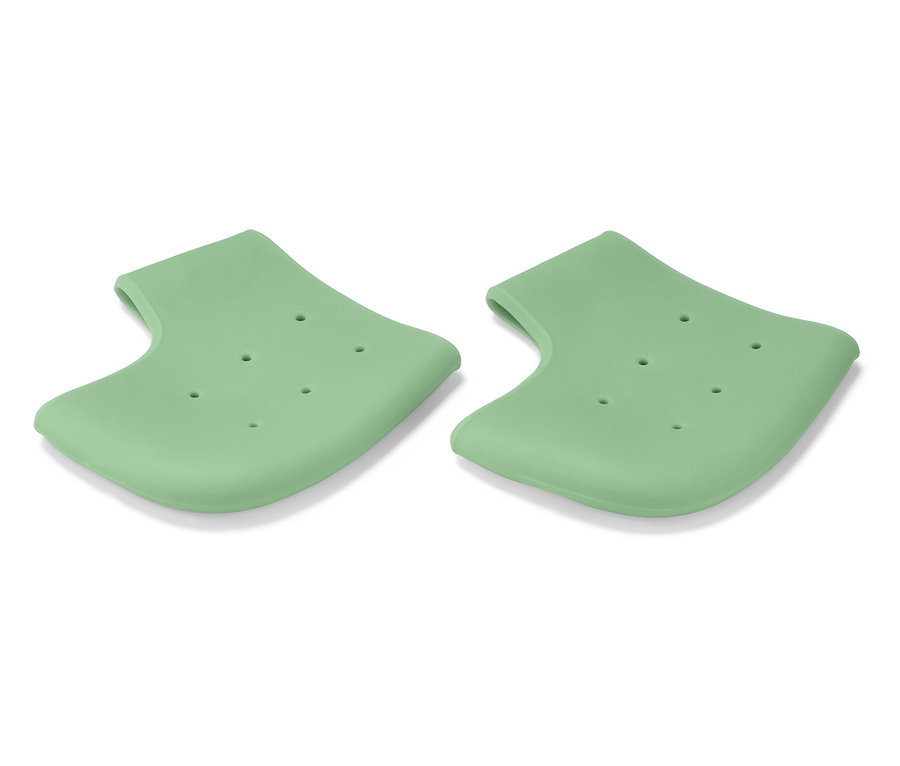 Zwei hellgrüne Silikon-Fersenschoner mit Löchern auf weißem Hintergrund.