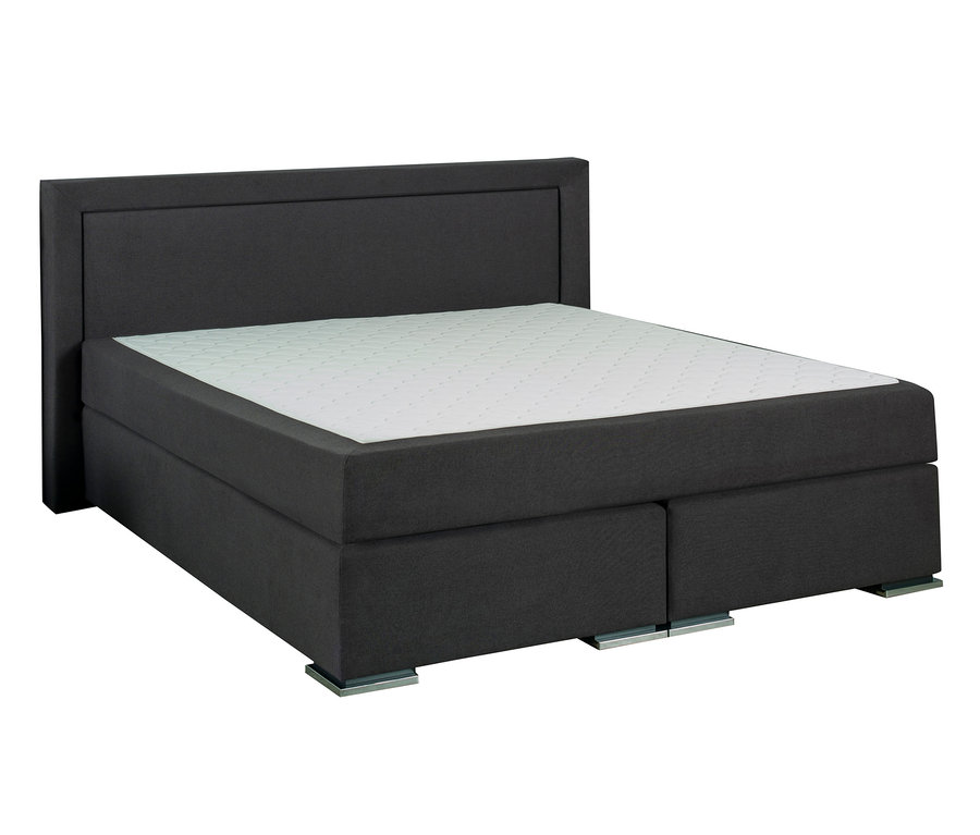 Ein dunkelgraues Boxspringbett mit einer weißen Matratze.