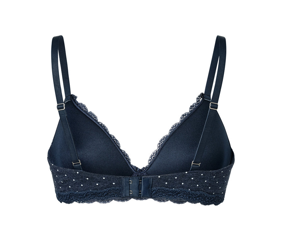 Detailansicht der Rückseite eines dunkelblauen Softschalen-BHs mit weißen Punkten.