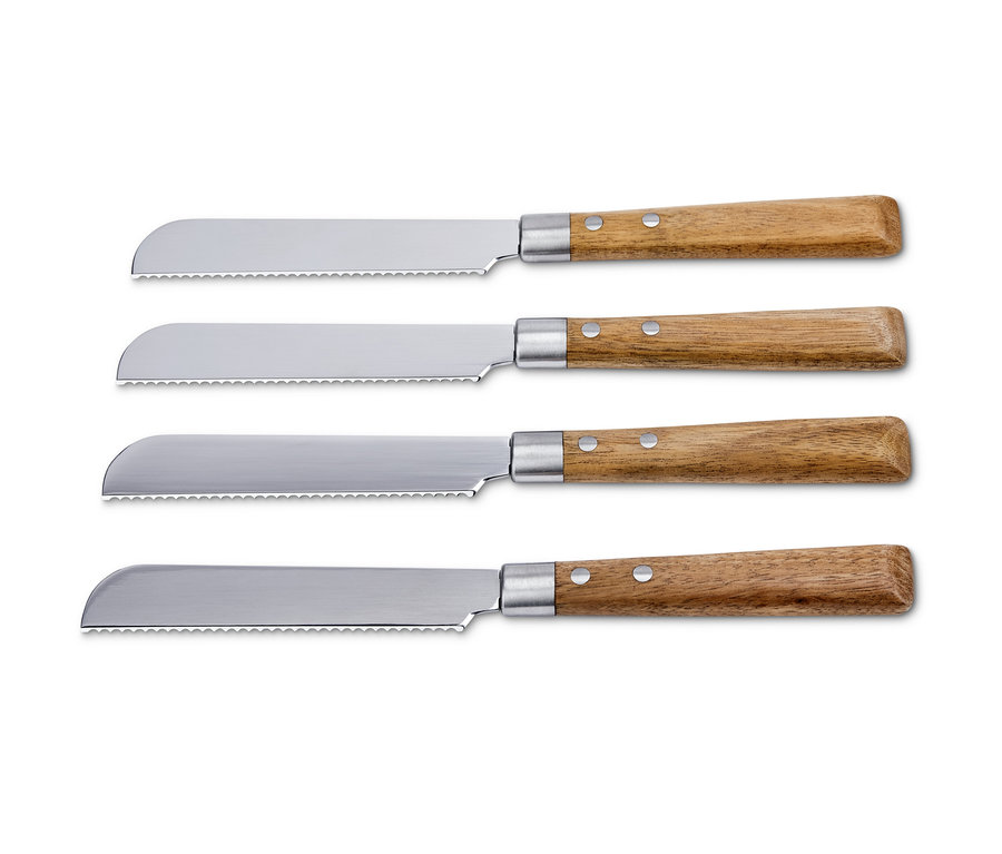 Vier Frühstücksmesser mit Holzgriff liegen nebeneinander.
