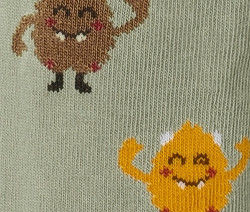 Detailaufnahme von 2 Strickleggings mit Monster-Motiven.