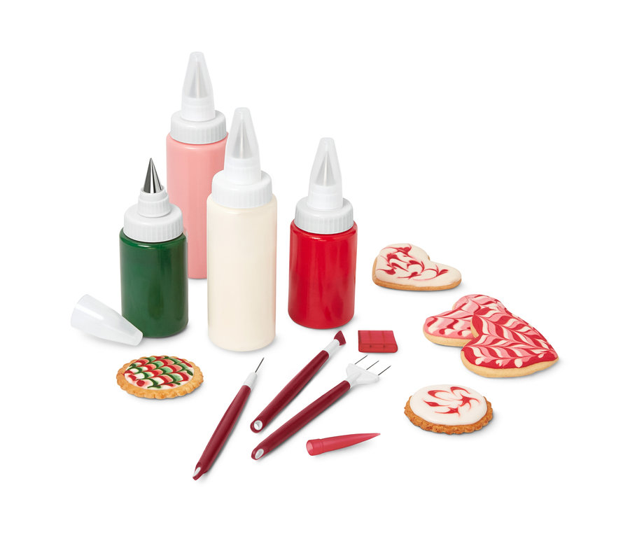 Ein Royal-Icing-Set mit farbigen Zuckergüssen und verzierten Keksen.