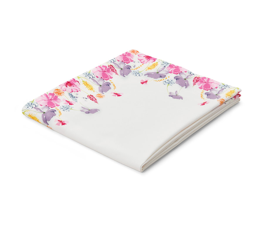 Gefaltete Baumwoll-Tischdecke mit Blumenmuster.