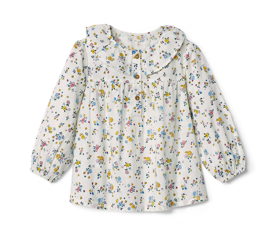 Kinder-Bluse mit Blumenmuster, langen Ärmeln und dekorativem Kragen.