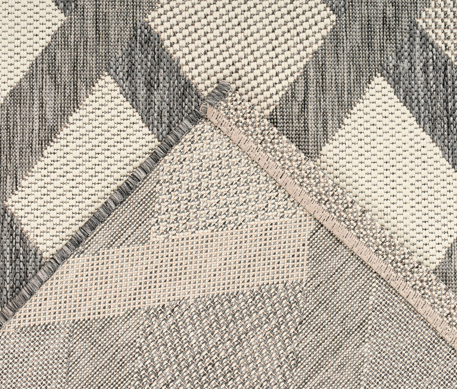 Nahaufnahme eines Kayoom Outdoorteppichs »Splash 800« in Creme mit geometrischem Muster.