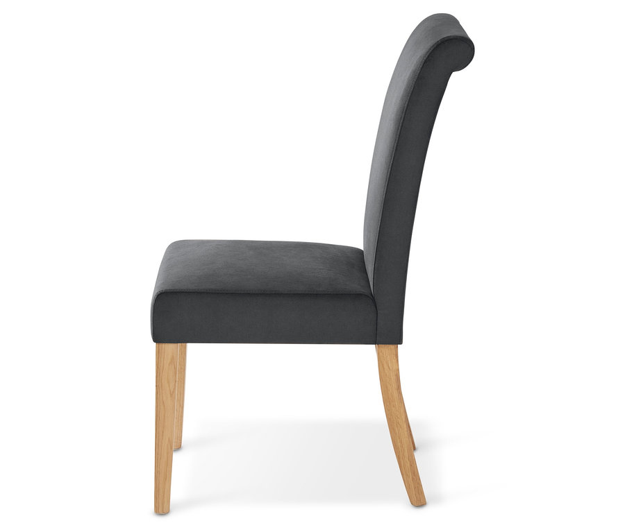 Seitenansicht eines gepolsterten Esszimmer-Stuhls mit Stoffbezug.