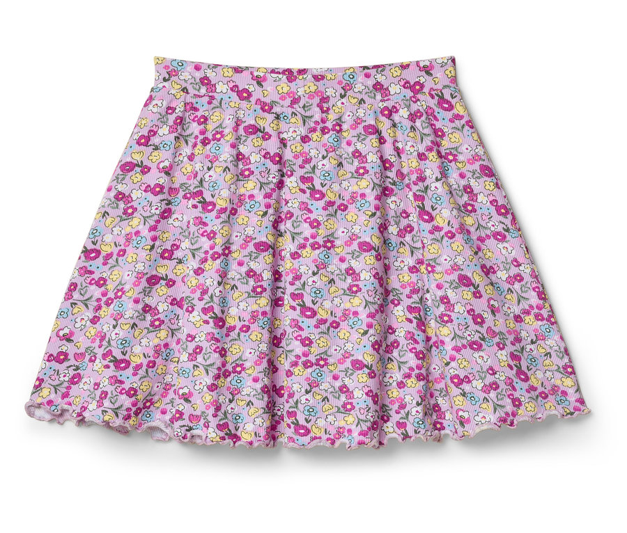 Ein ausgestellter Rock mit einem rosa Blumenmuster liegt auf einem weißen Hintergrund.