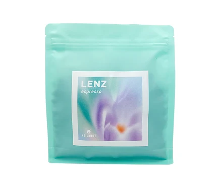 Eine hellblaue Packung Heilandt - Lenz Espresso mit einem weißen Etikett mit einer lila Blume darauf.